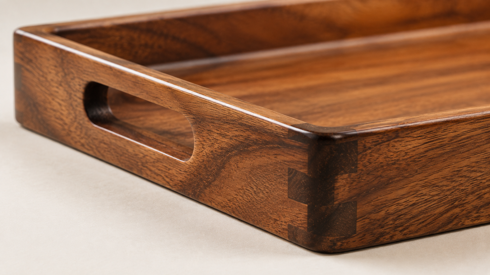 Close up detail of wooden serving tray handle and edge